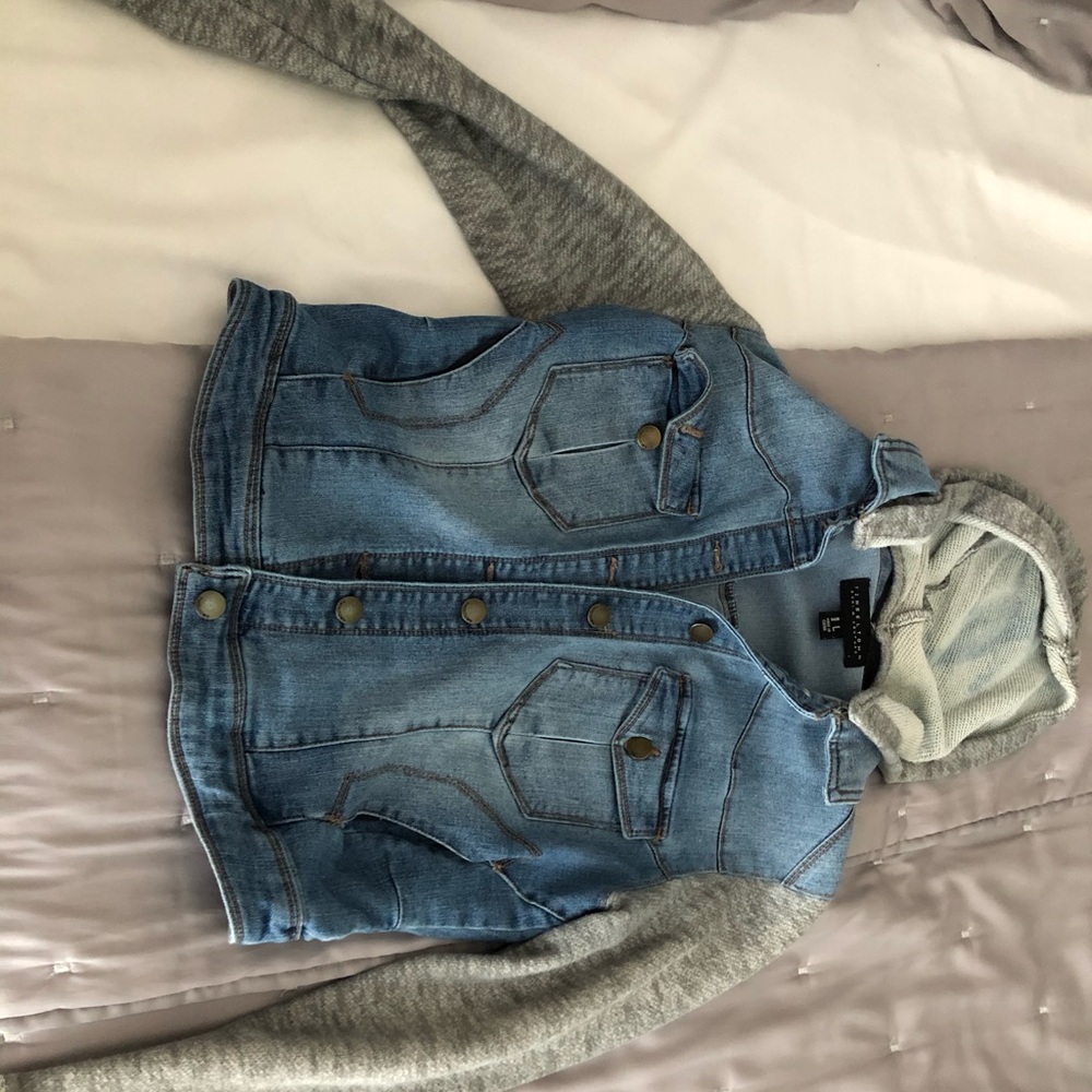 Denim jacket with sweater sleeves